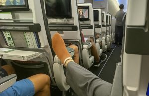 A passenger was blocking the aisle with her smelly foot, but I managed to teach her a lesson — and the whole cabin cheered me